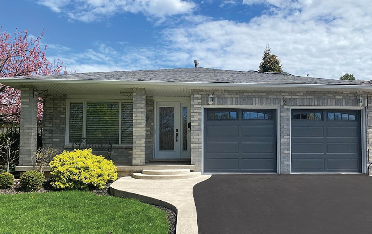Calgary bungalow with new insulated grey garage doors